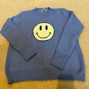 NWOT. MISS SPARKLING sweater with smiley facE. Minor pull - see picture.